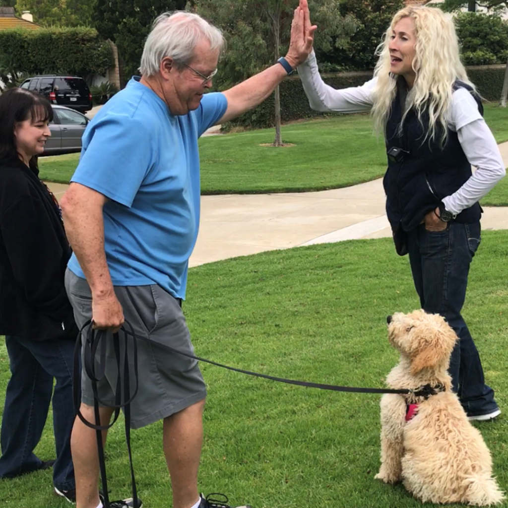 Jennifer with 2 clients and their dog